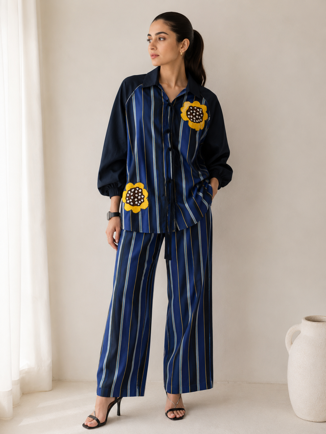 Striped shirt with hand-embroidered contrasting flowers