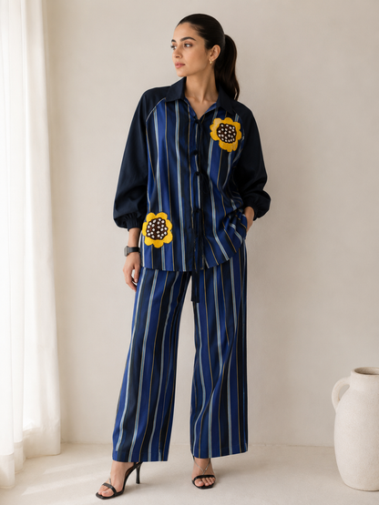 Striped shirt with hand-embroidered contrasting flowers
