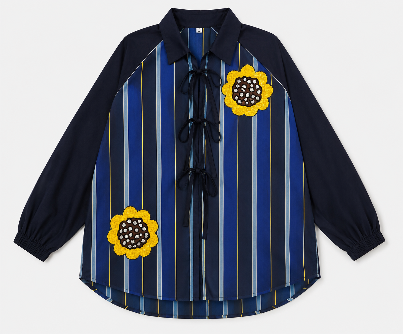 Striped shirt with hand-embroidered contrasting flowers